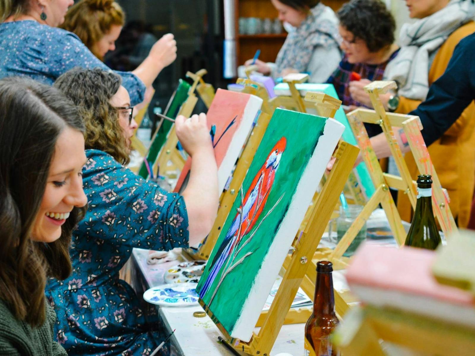 People painting birds People painting birds