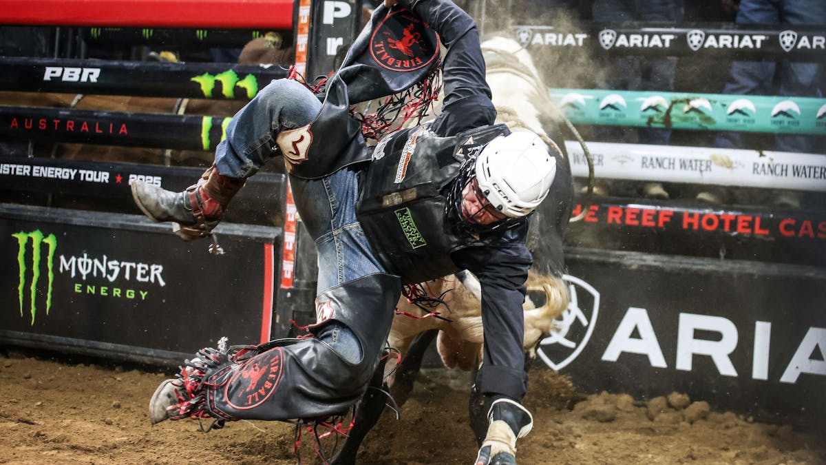 PBR cowboy falls off bull PBR cowboy falls off bull