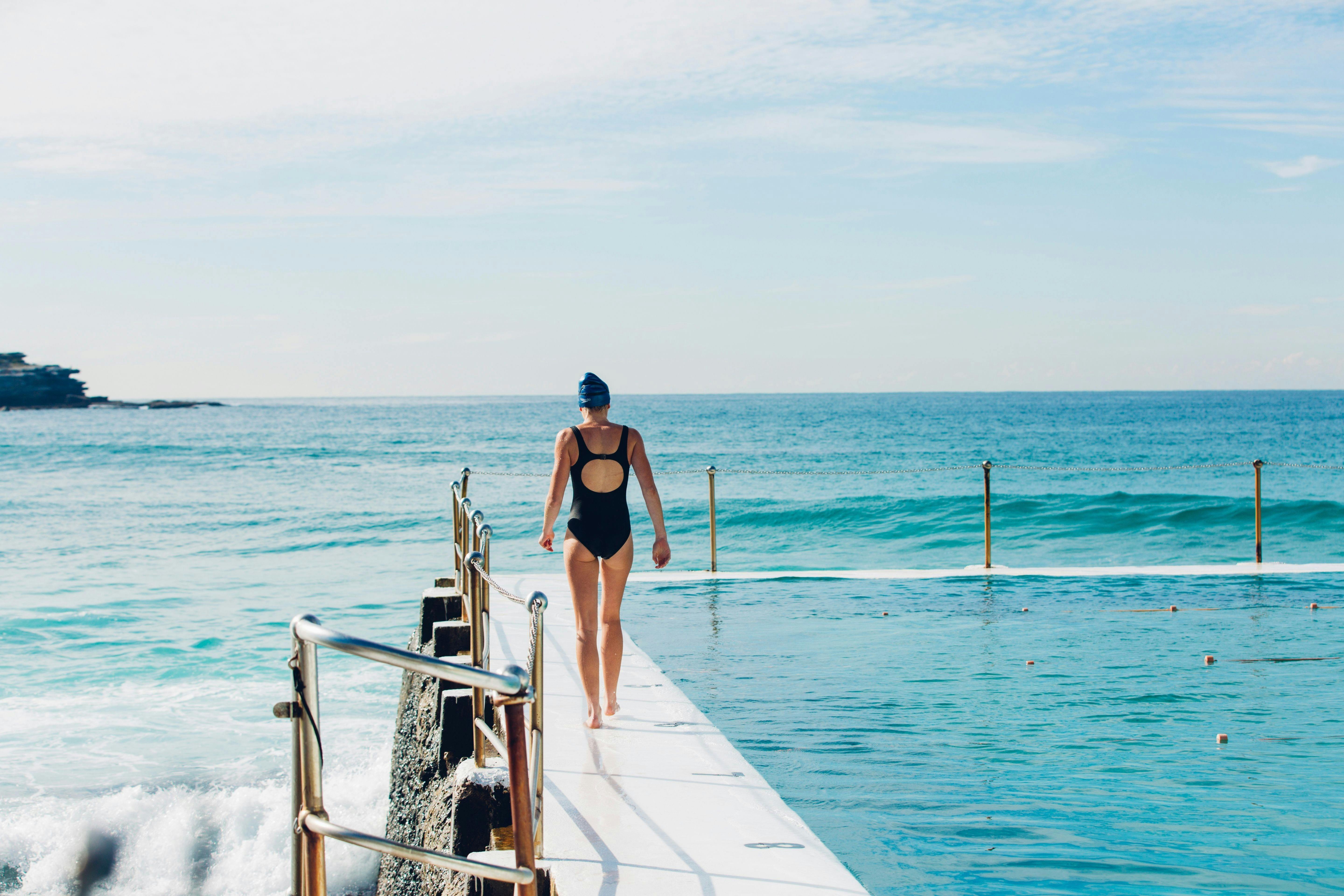 Woman out for a morning swim at Bondi Icebergs, Bondi Beach