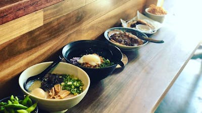 Bowls of ramen on long table