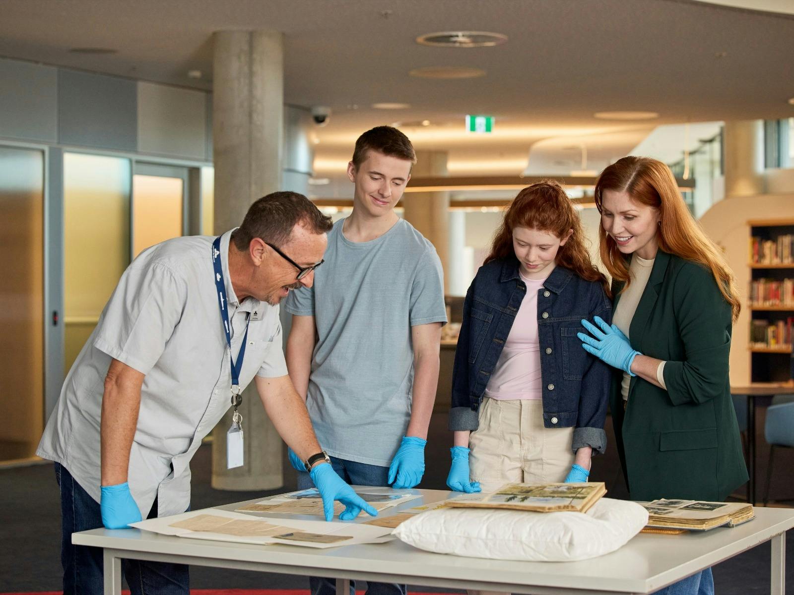 Visitors looking at Collection Items in the  Charles Bean Research Centre at the Memorial