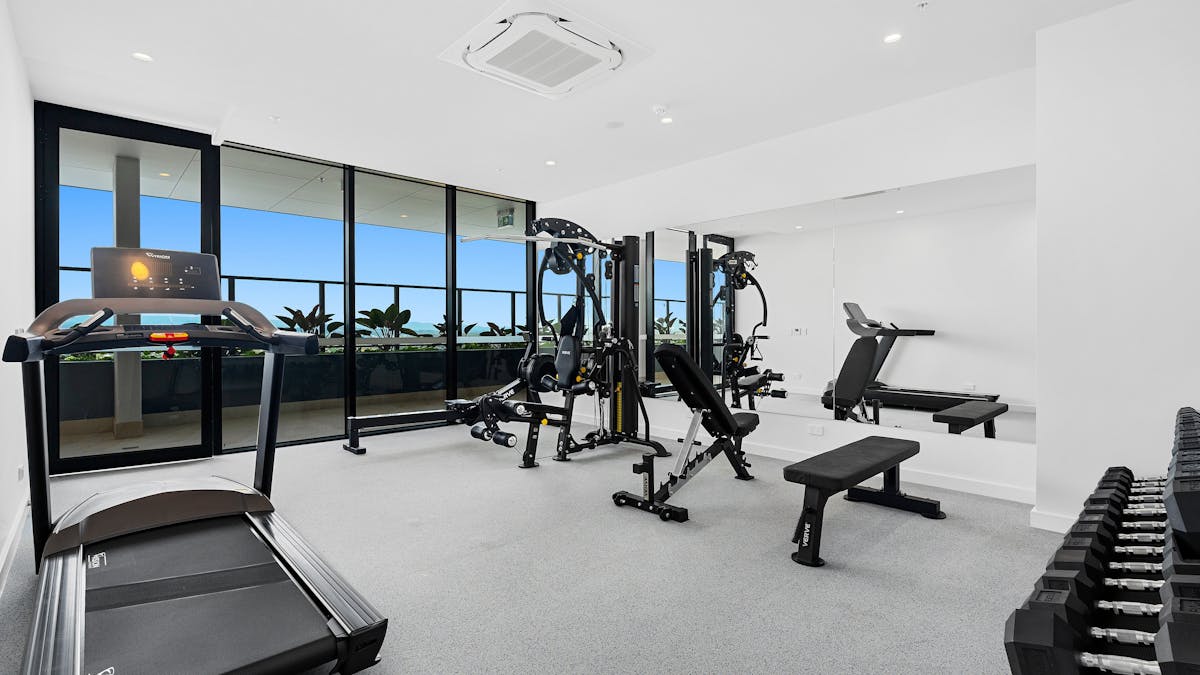 State-of-the-art fitness center with modern equipment, ideal for workouts with a view of the Gold Co