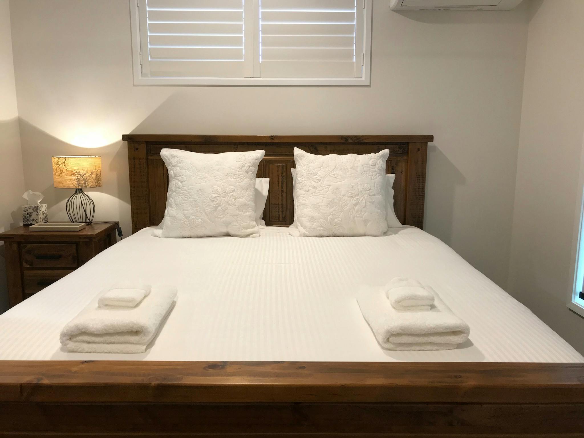 King size bed with white linen