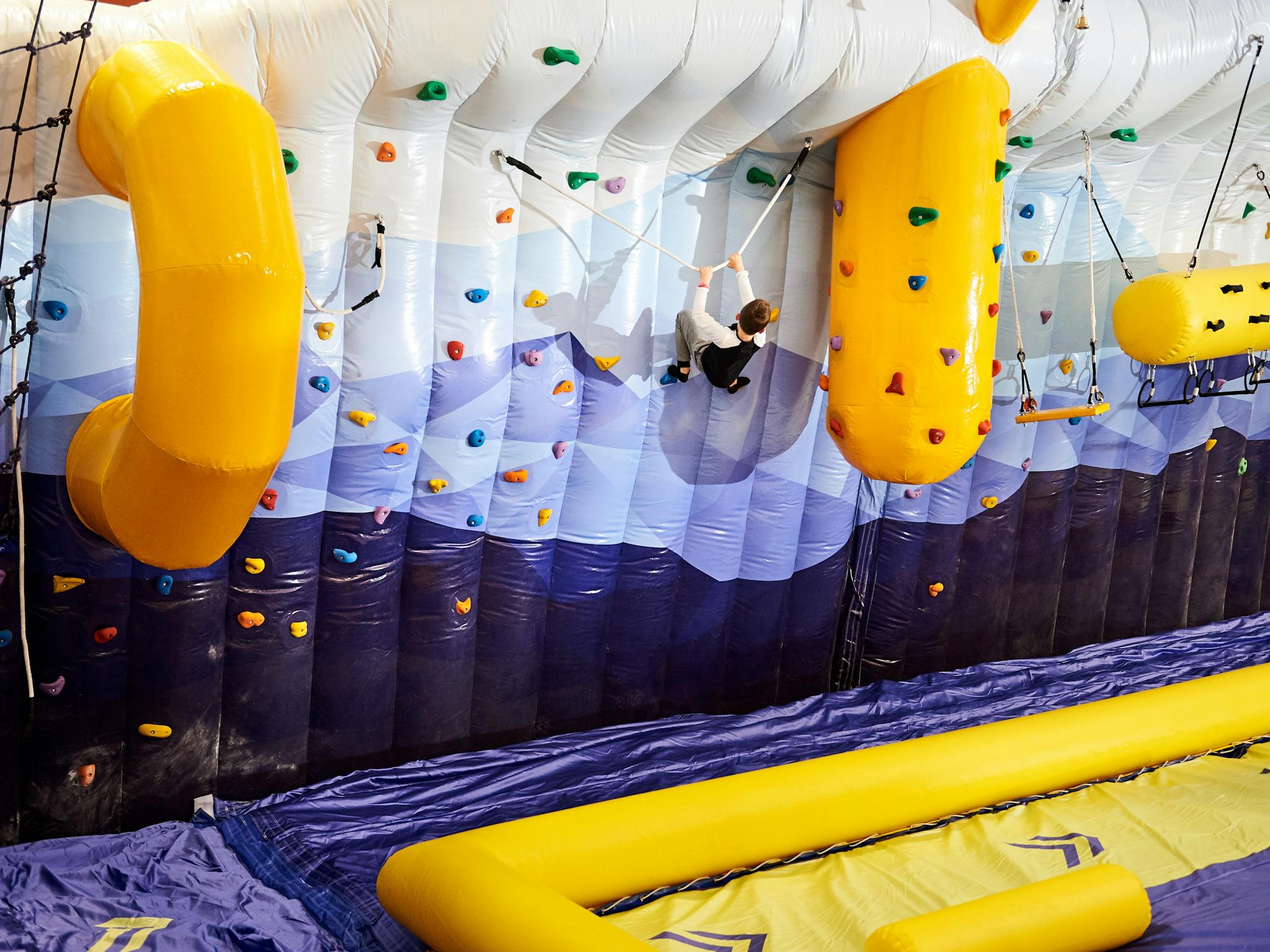 Tackling the inflatable climbing wall at Buller Air Zone