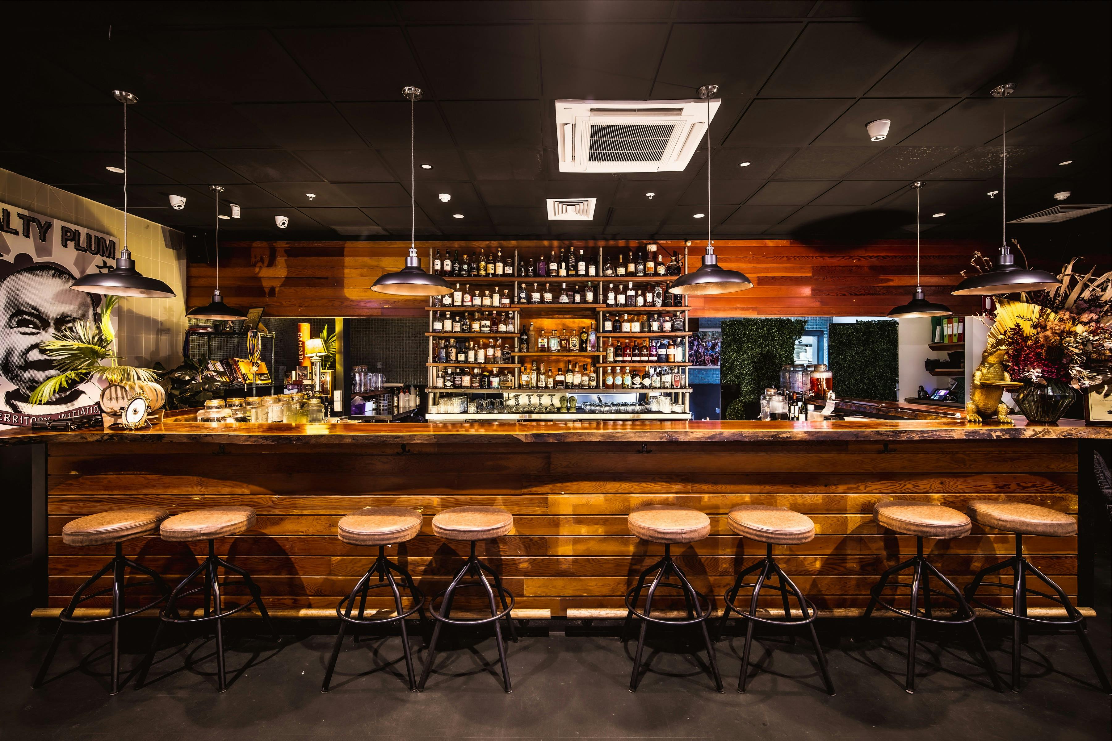 The inside bar at Charlie's of Darwin  with bar stools