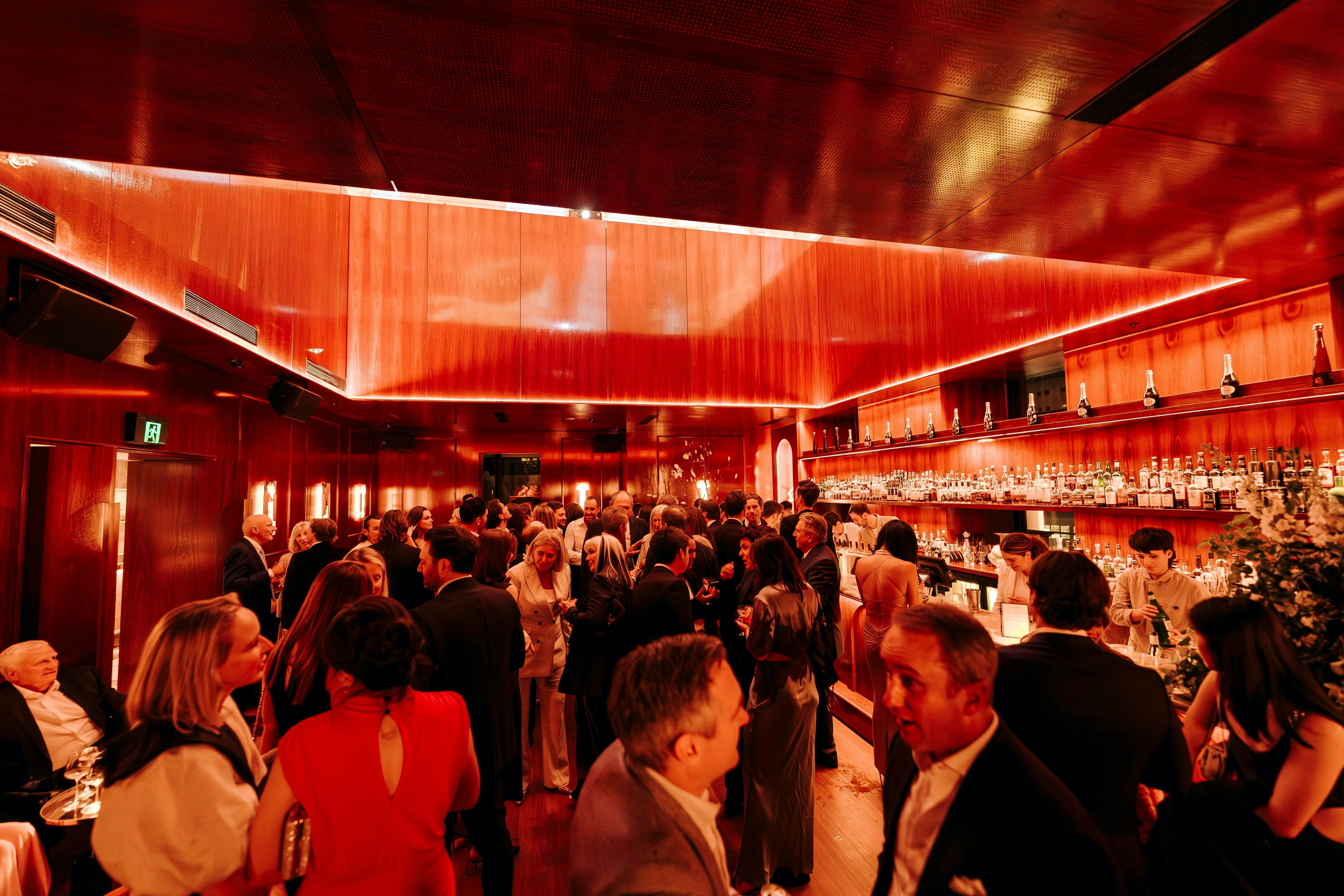 crowd of people in clocktower bar