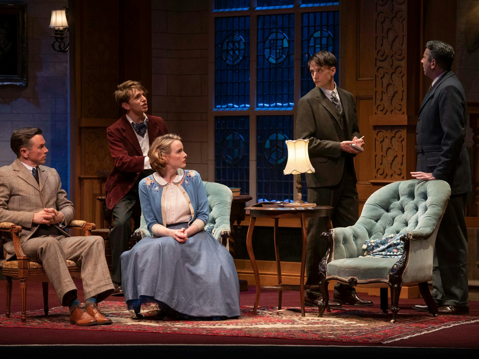 Actors from The Mousetrap are on stage on the set of the production.