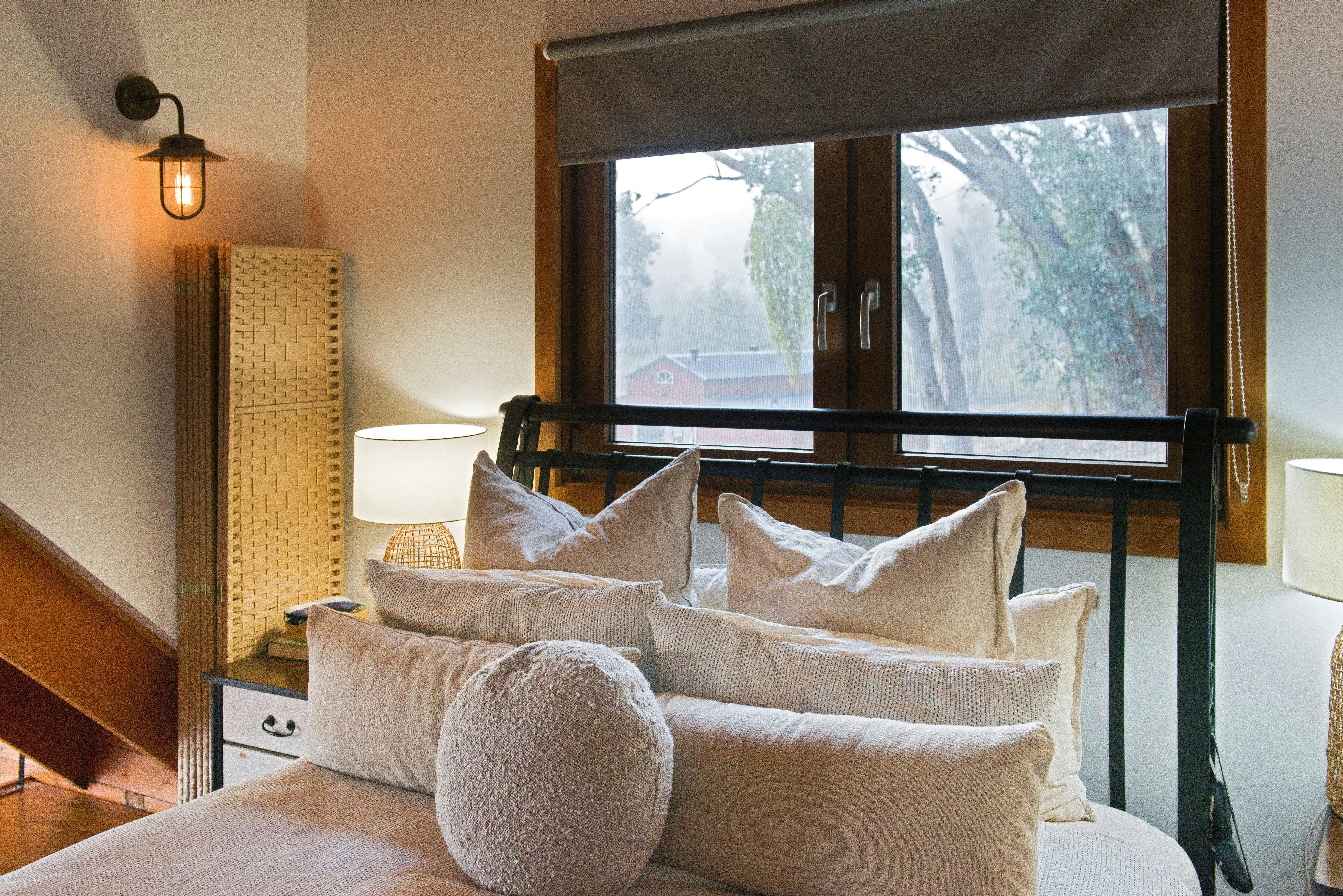 Close-up of bed and window & view in master bedroom.