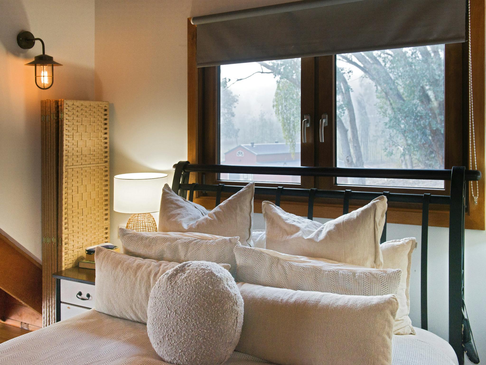 Close-up of bed and window & view in master bedroom.