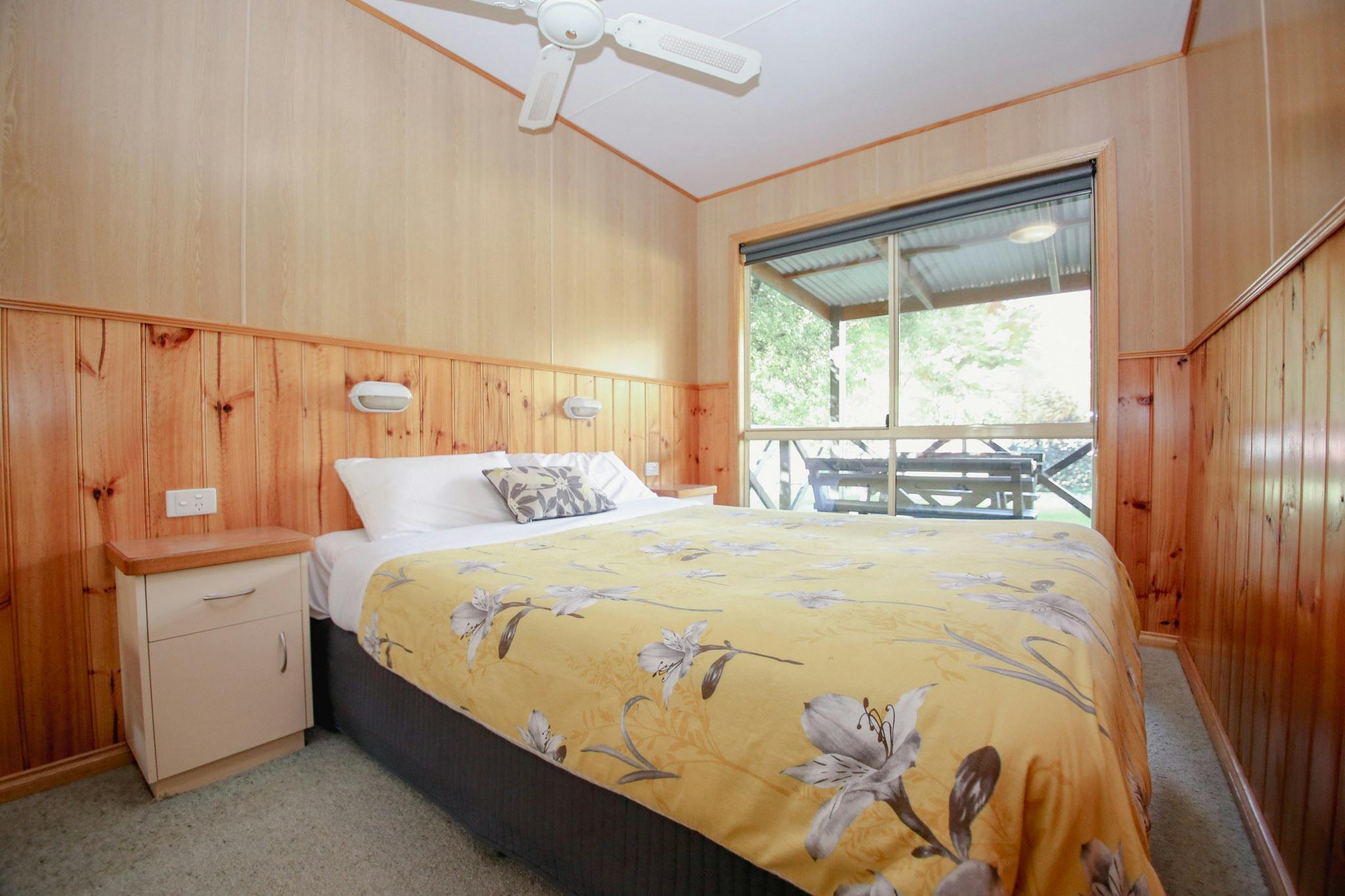 image of master room in Cabi with a queen bed beside a window