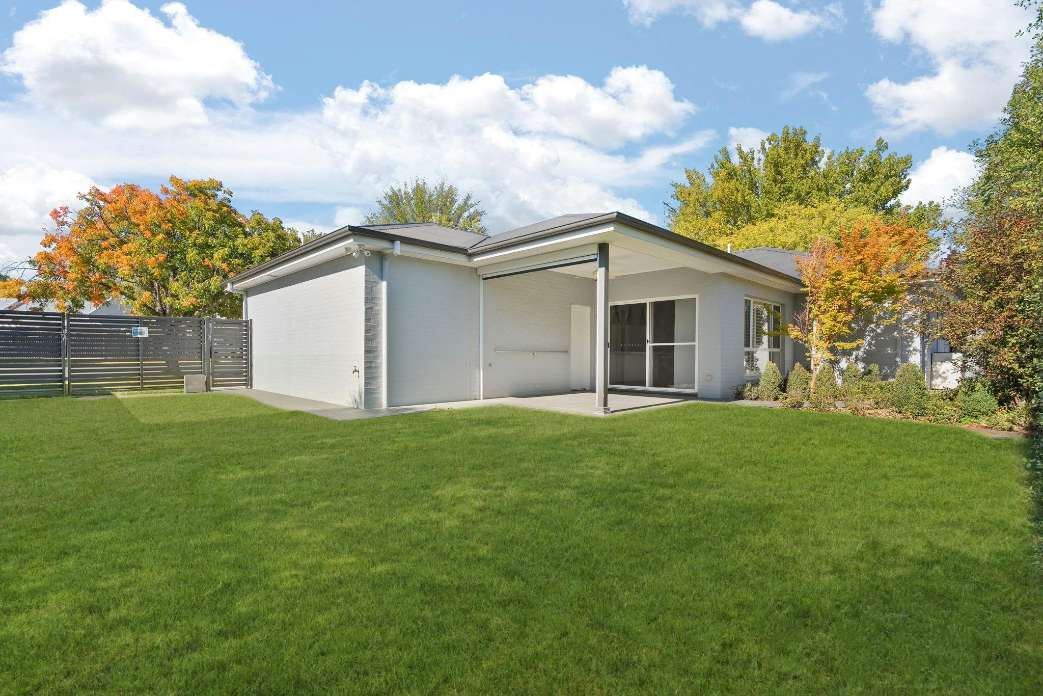 Backyard with undercover verandah, side gate and lush garden