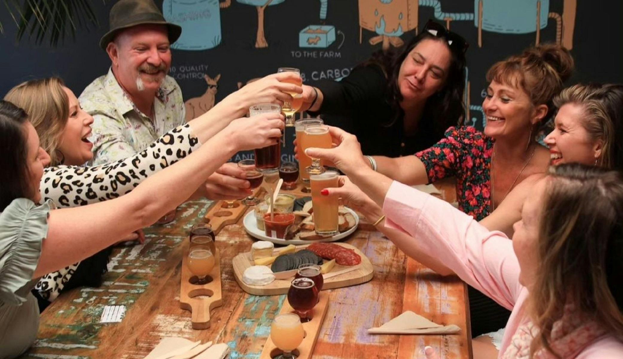 Group celebrating at local brewery