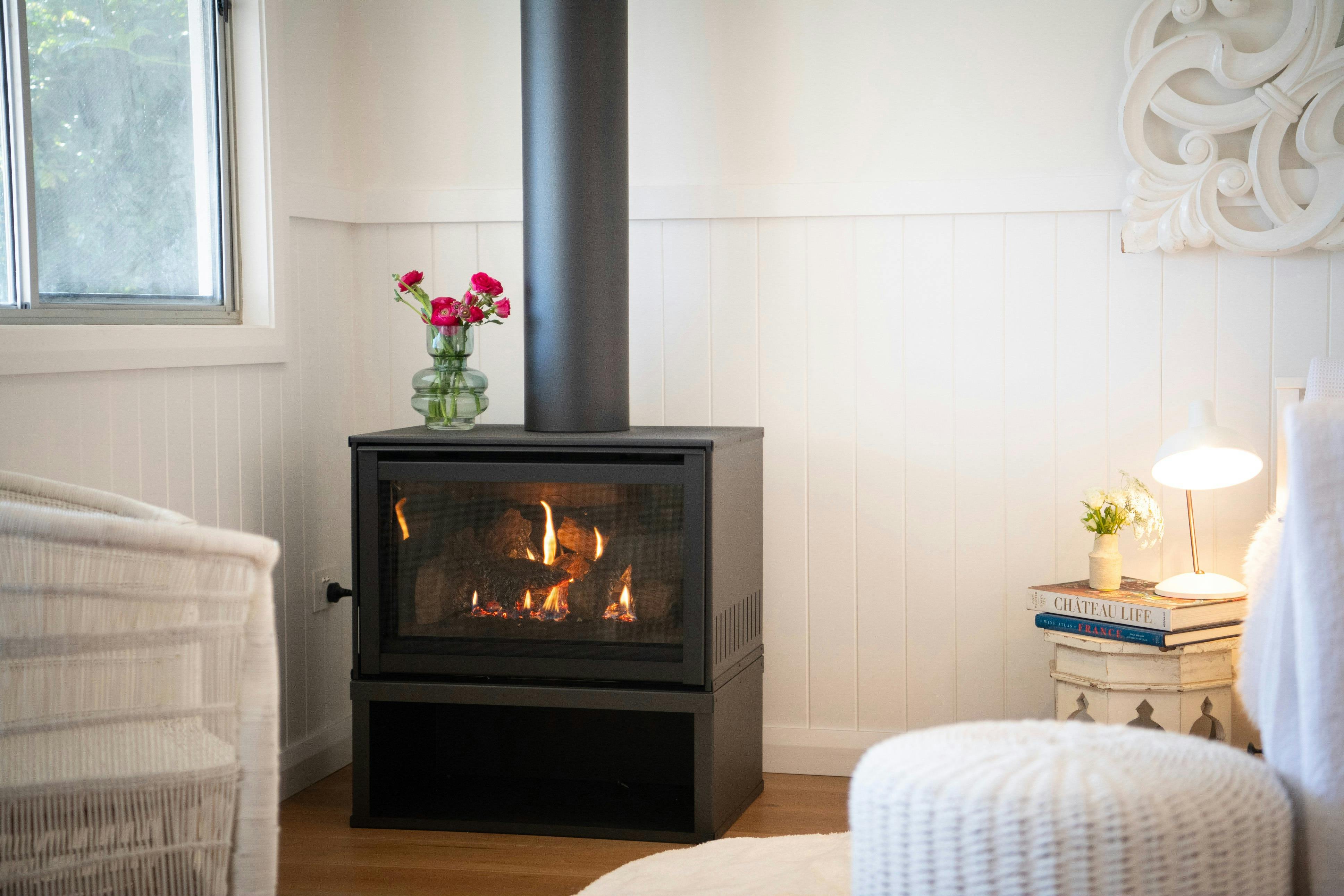 Gas fireplace at Lady Rose Cottage with modern surround and warm glow