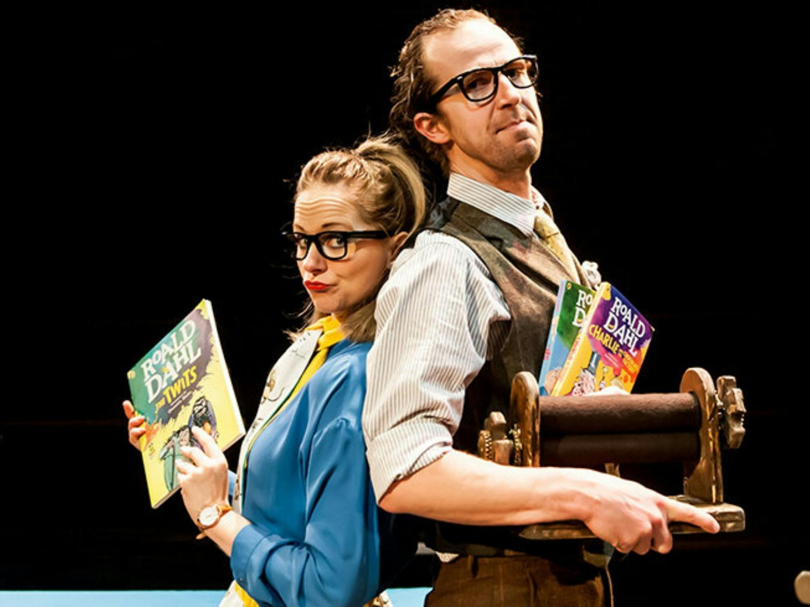 Brenda and Terrance stand back to back holding Roald Dahl Books