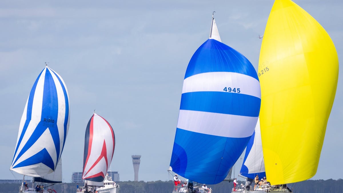 Yachts with spinnakers on Brisbane to Gladstone Yacht Race 2022 start line