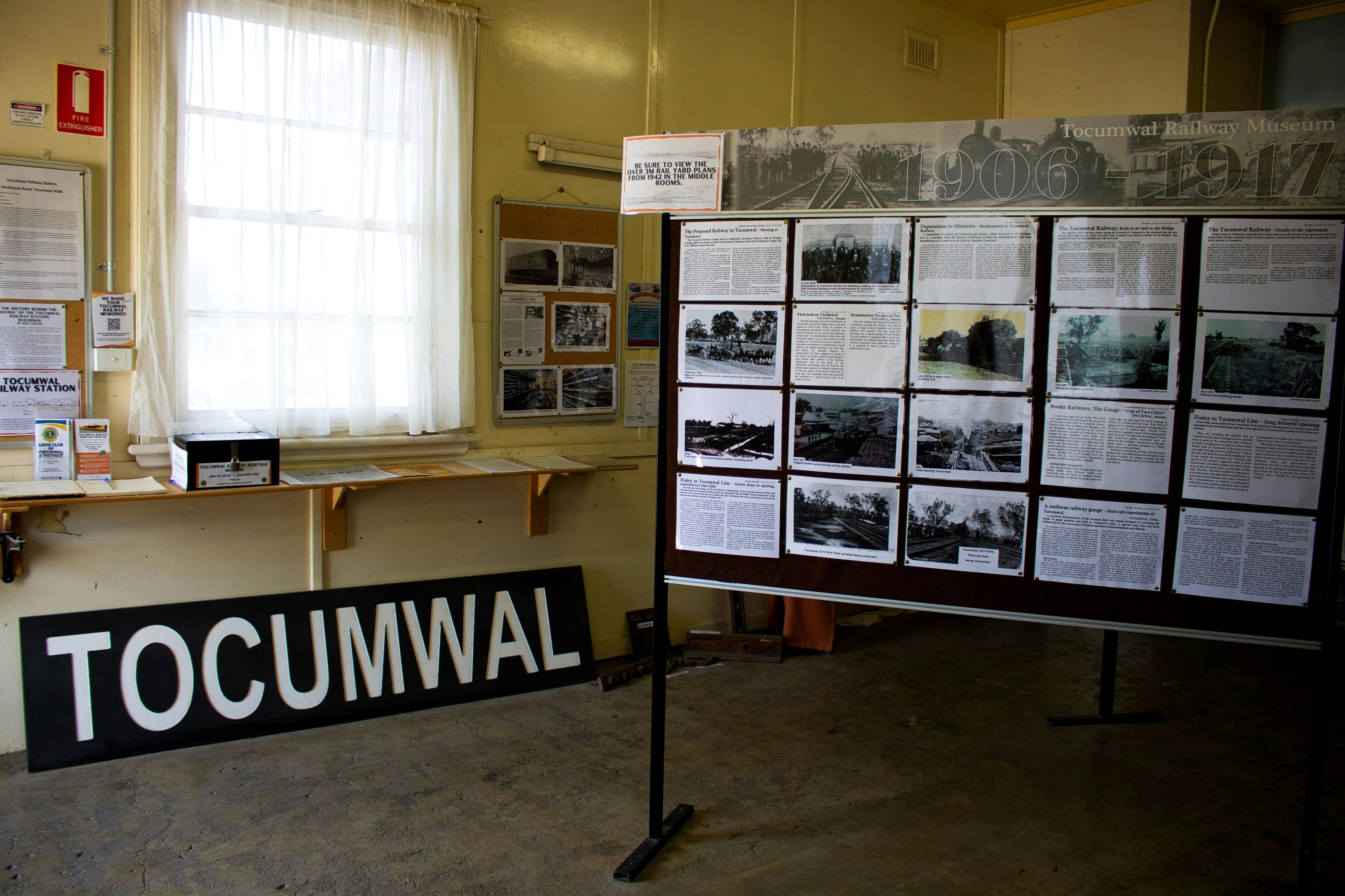 Museum interior, featuring display boards of  photos and information