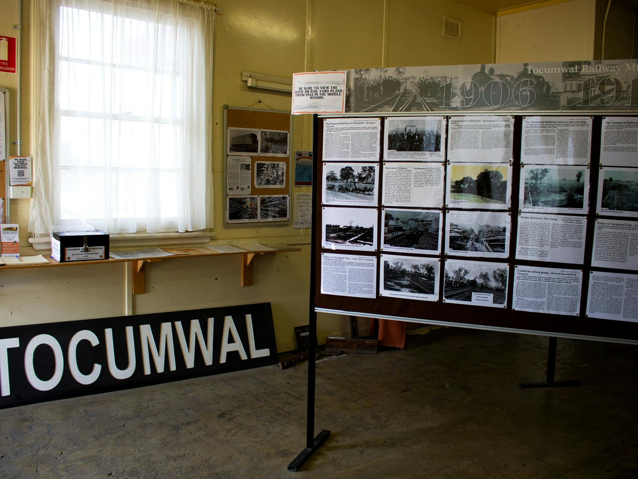 Museum interior, featuring display boards of  photos and information