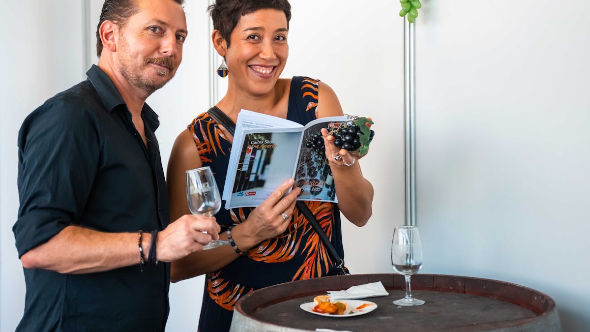 Couple looking at Wine Results Catalogue Couple looking at Wine Results Catalogue