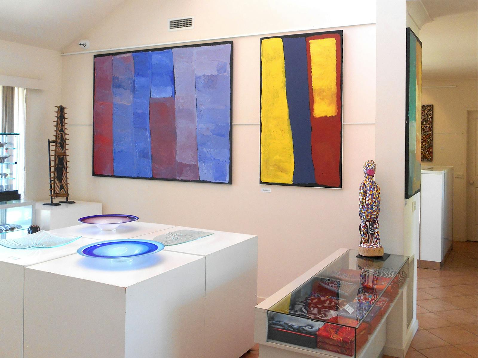 Colourful paintings, sculptures and art glass.
