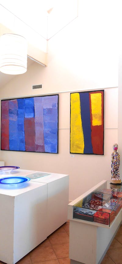 Colourful paintings, sculptures and art glass.
