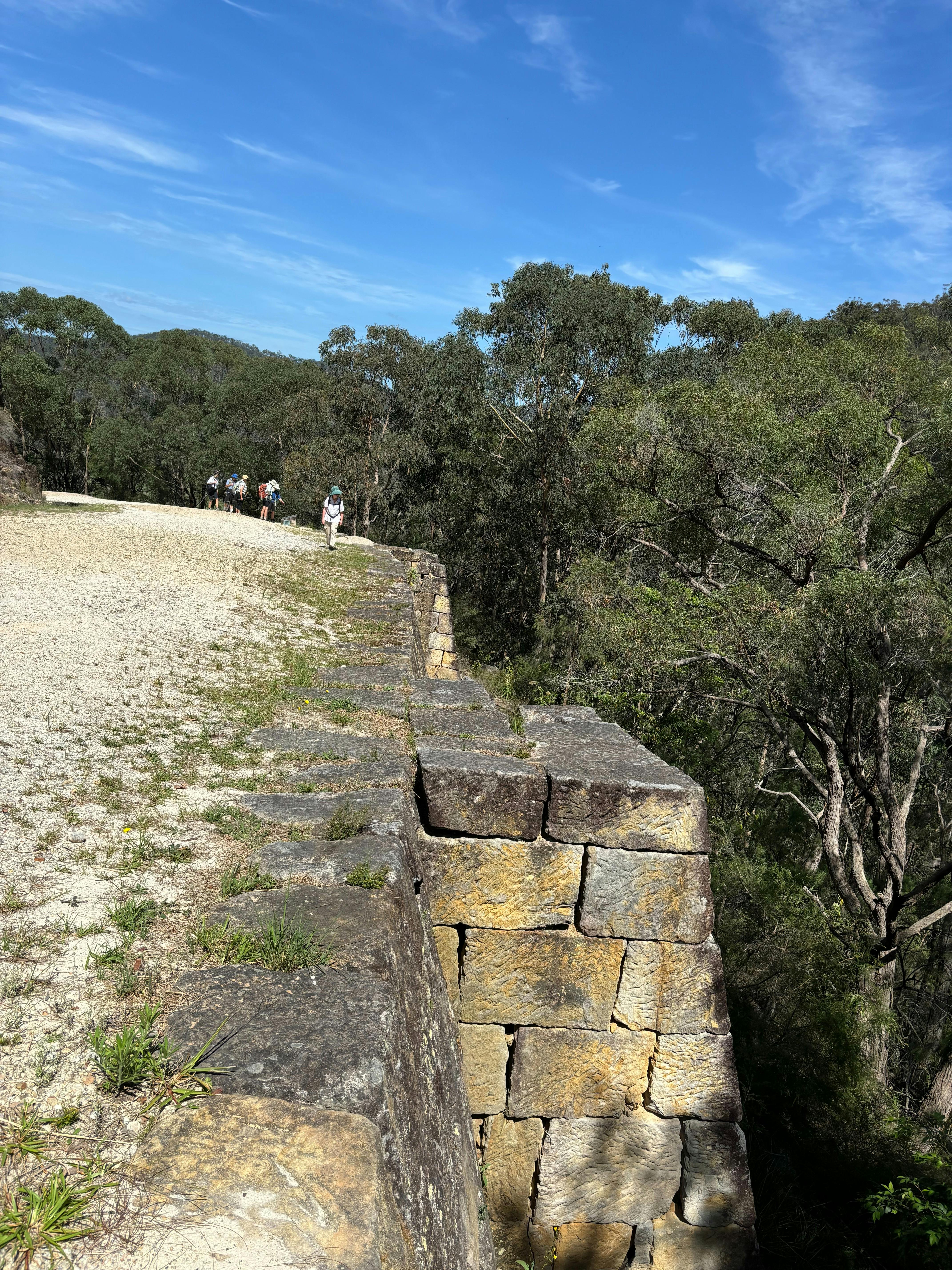 Gravel road supported by huge sand stone buttresses erected by convicts.