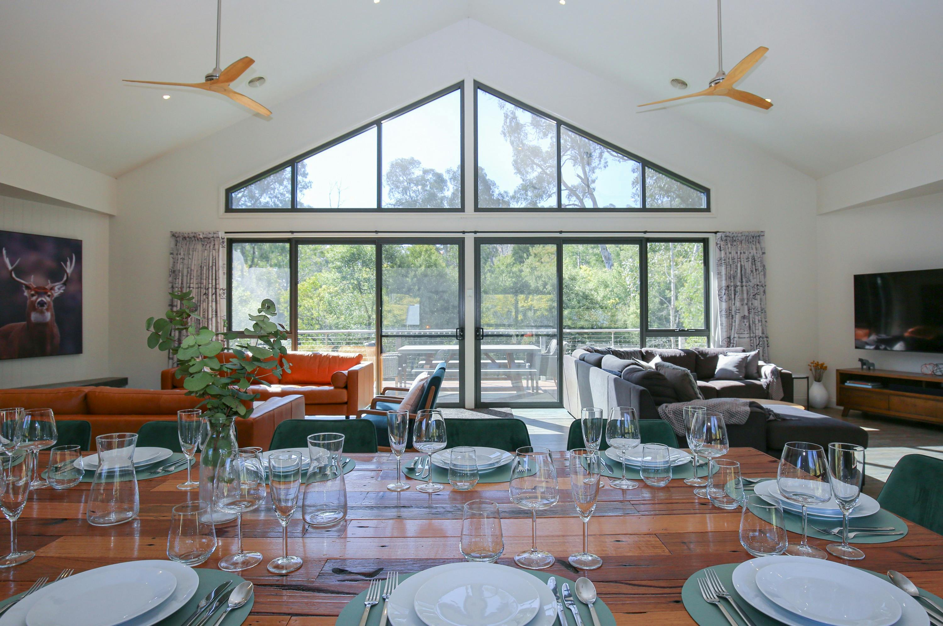 Northern Exposure Bright living room and lounge area featuring tall windows
