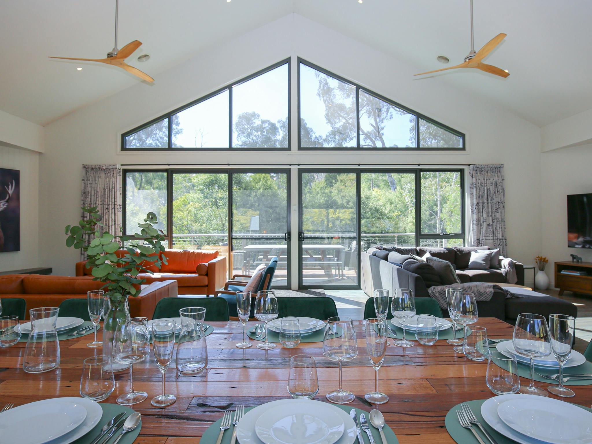 Northern Exposure Bright living room and lounge area featuring tall windows