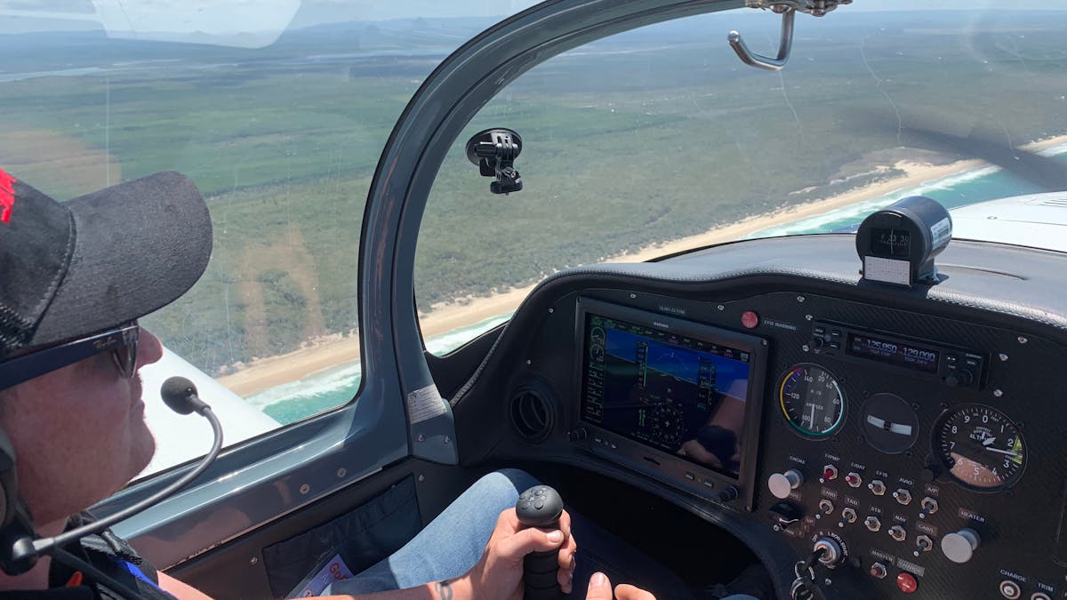 Steer plane while flying over coast