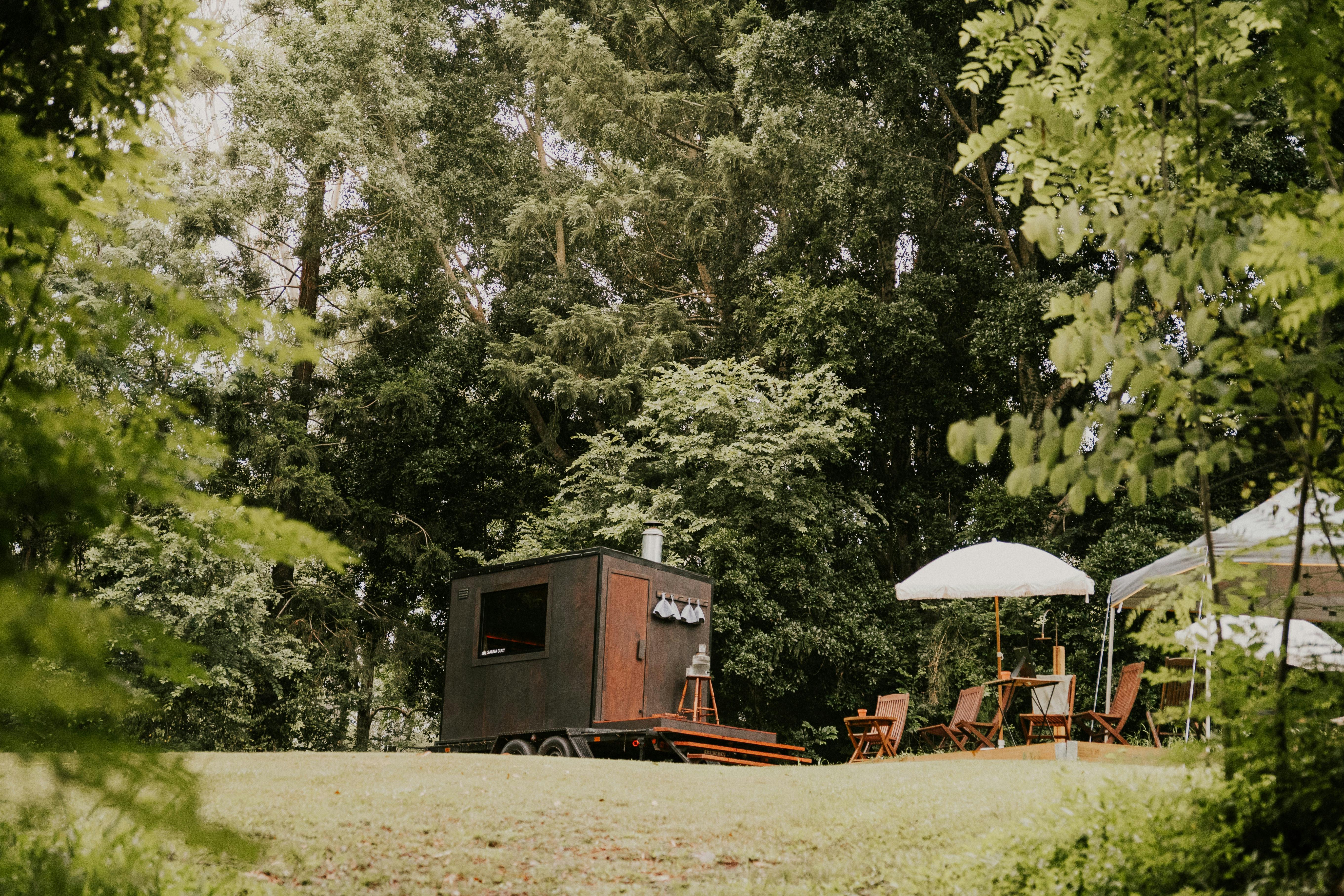 Exterior of Sauna Cult Brisbane's wood-fired sauna with a panoramic window and cozy design.