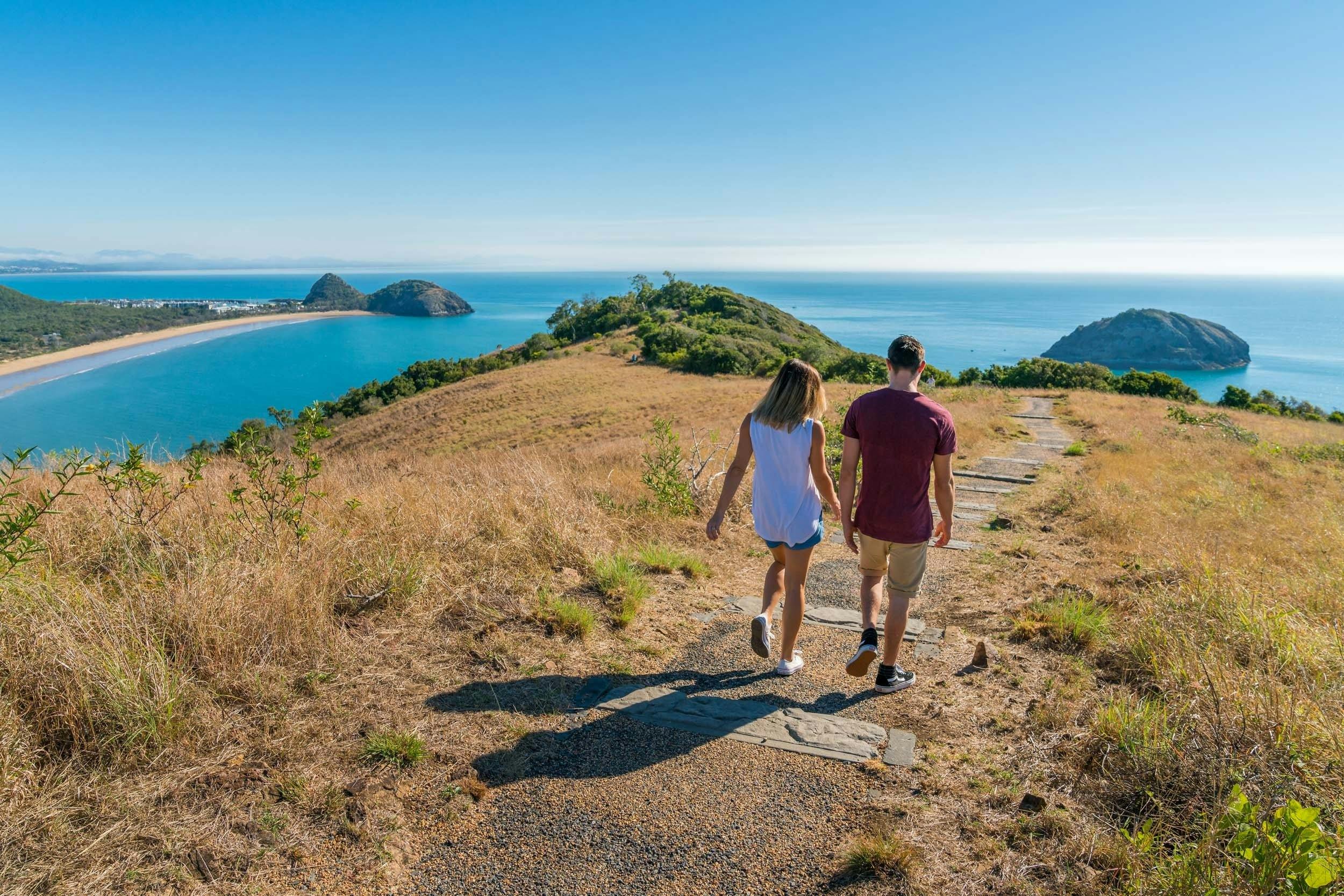Two people walking along Bluff Point Circuit