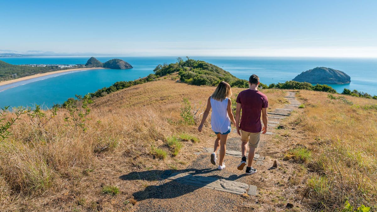 Two people walking along Bluff Point Circuit