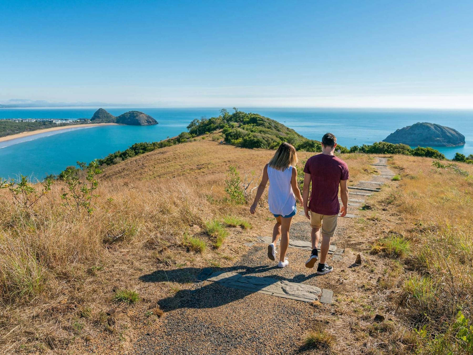 Two people walking along Bluff Point Circuit
