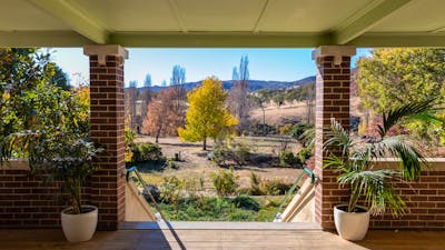 view from a verrandah overlooking a garden in autumn