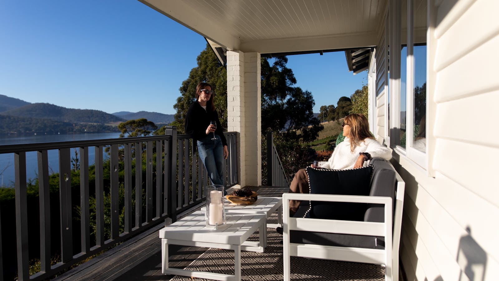 Relax on the expansive balcony at Woodland Bay Retreat