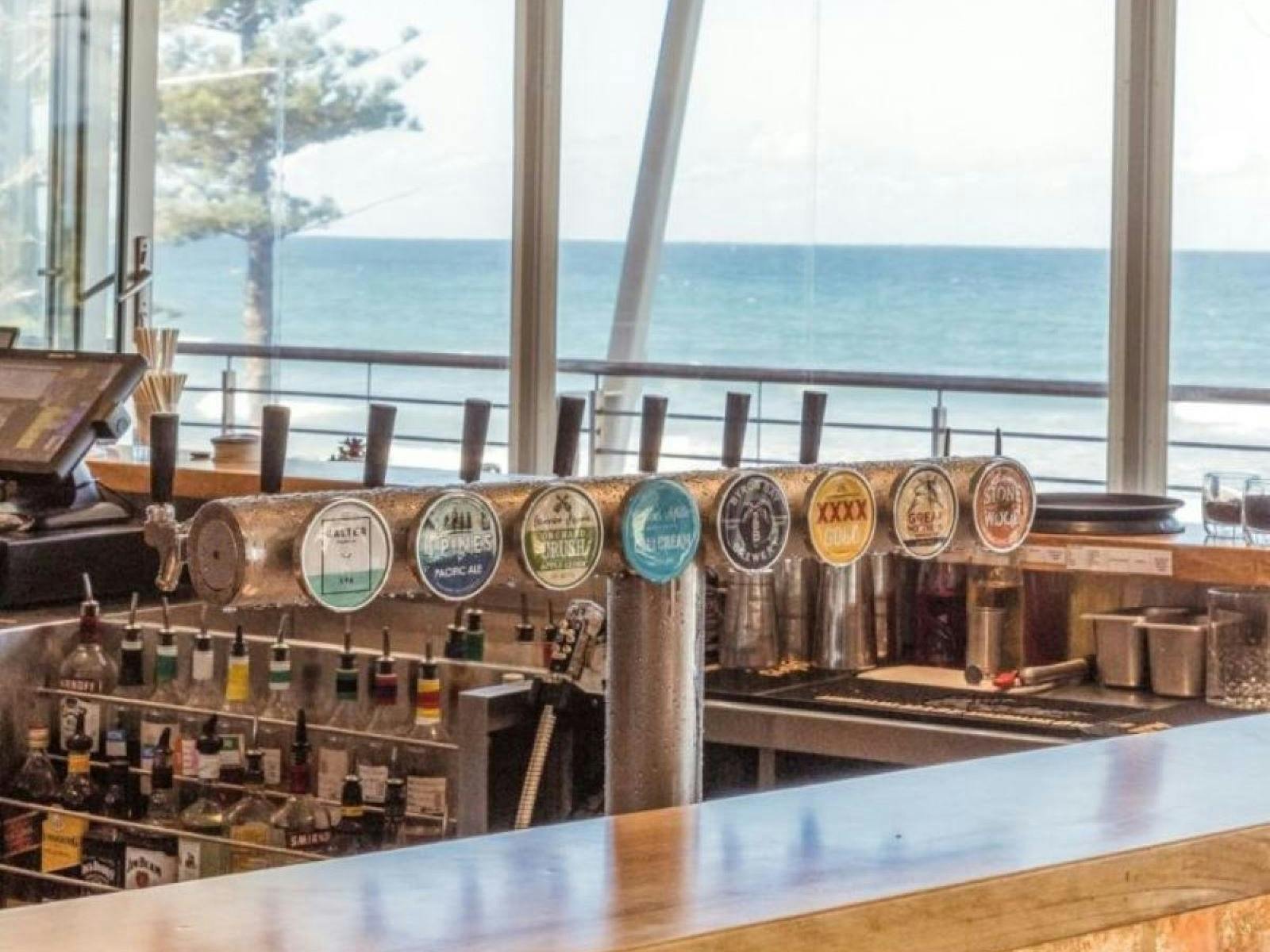 View of the ocean over the bar taps