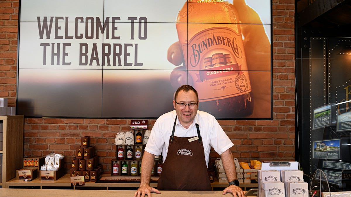 Bundaberg Barrel team member welcomes visitors to a taste-filled local experience.