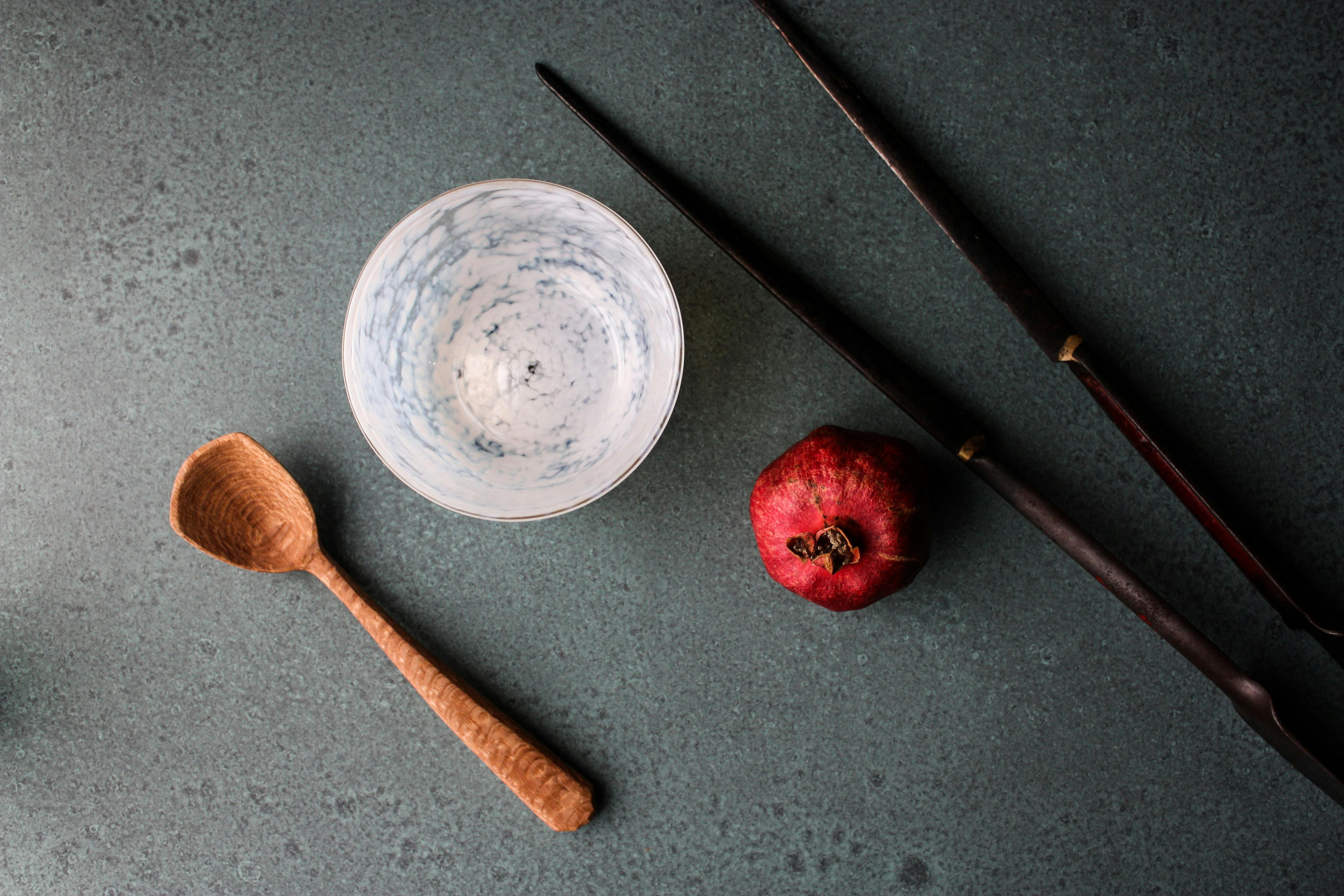 hand carved wooden spoon, and blown bowl