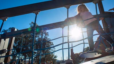 Girl on a moving bridge in the Boundless Playground