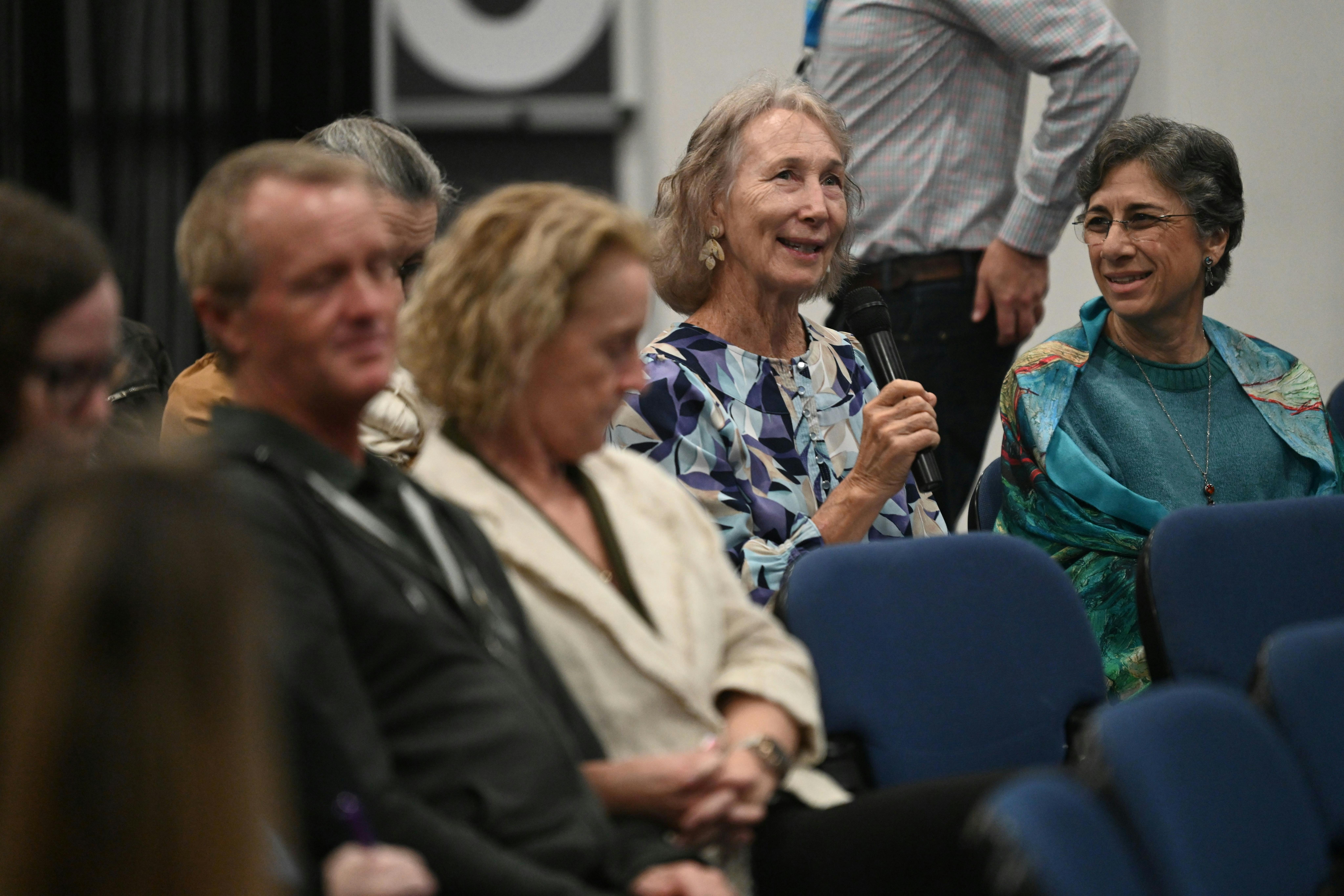 Participants asking questions.