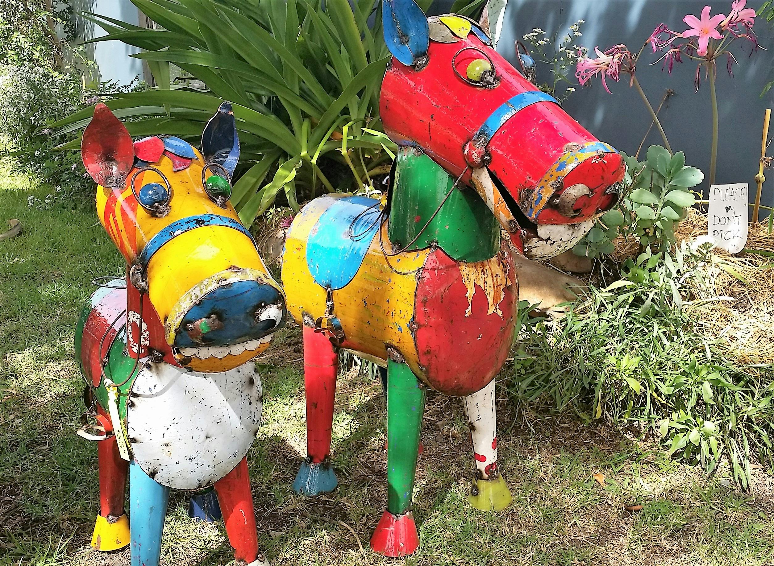 two colourful artworks on grass