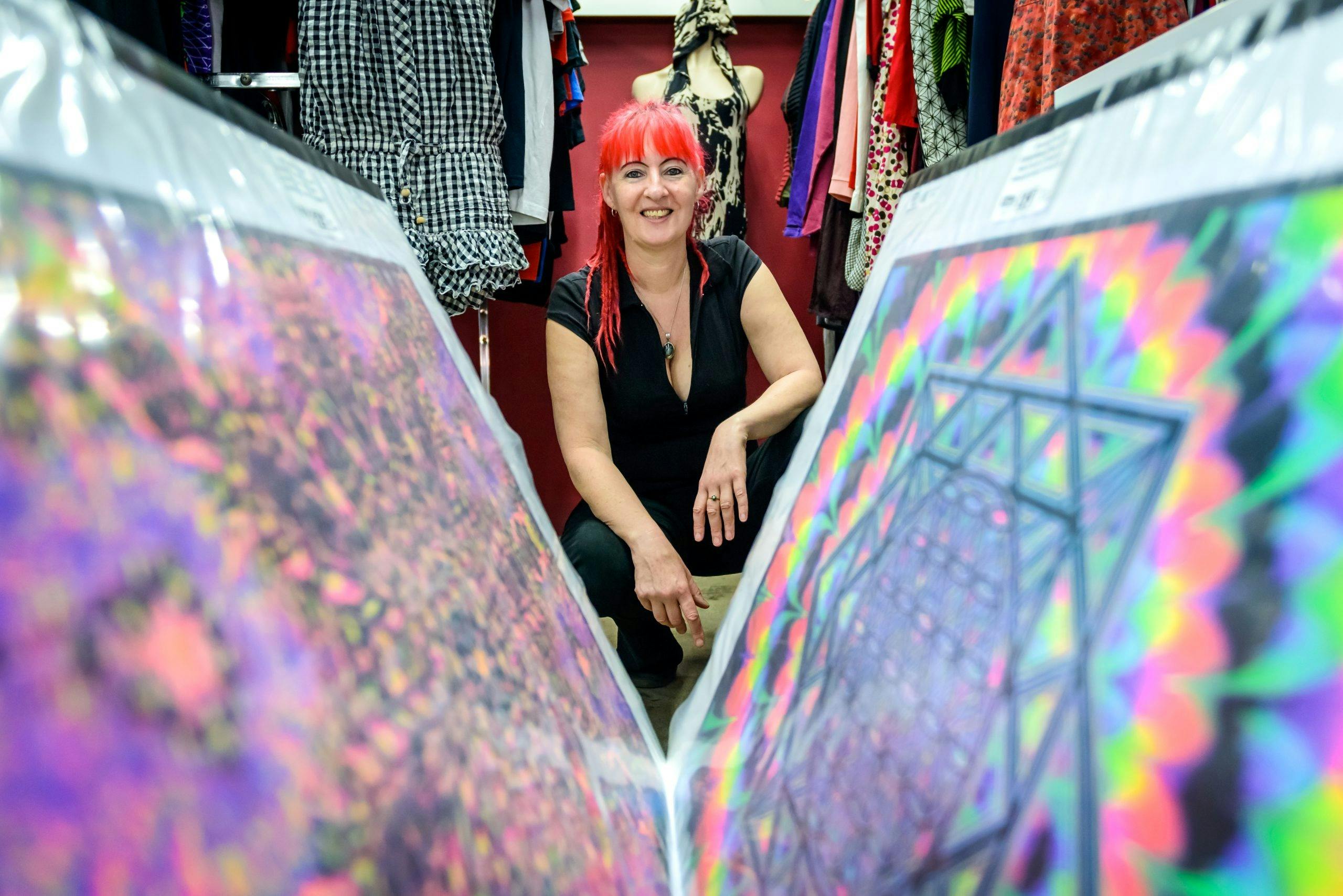 Owner of the shop looking through the record display