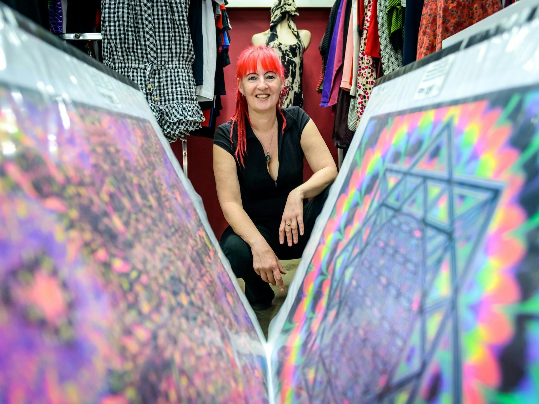 Owner of the shop looking through the record display