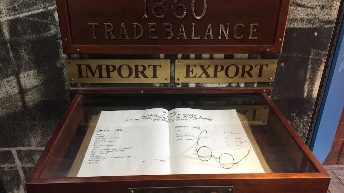 Photo of display showing book with record of imports and exports through Maryborough Port in 1860