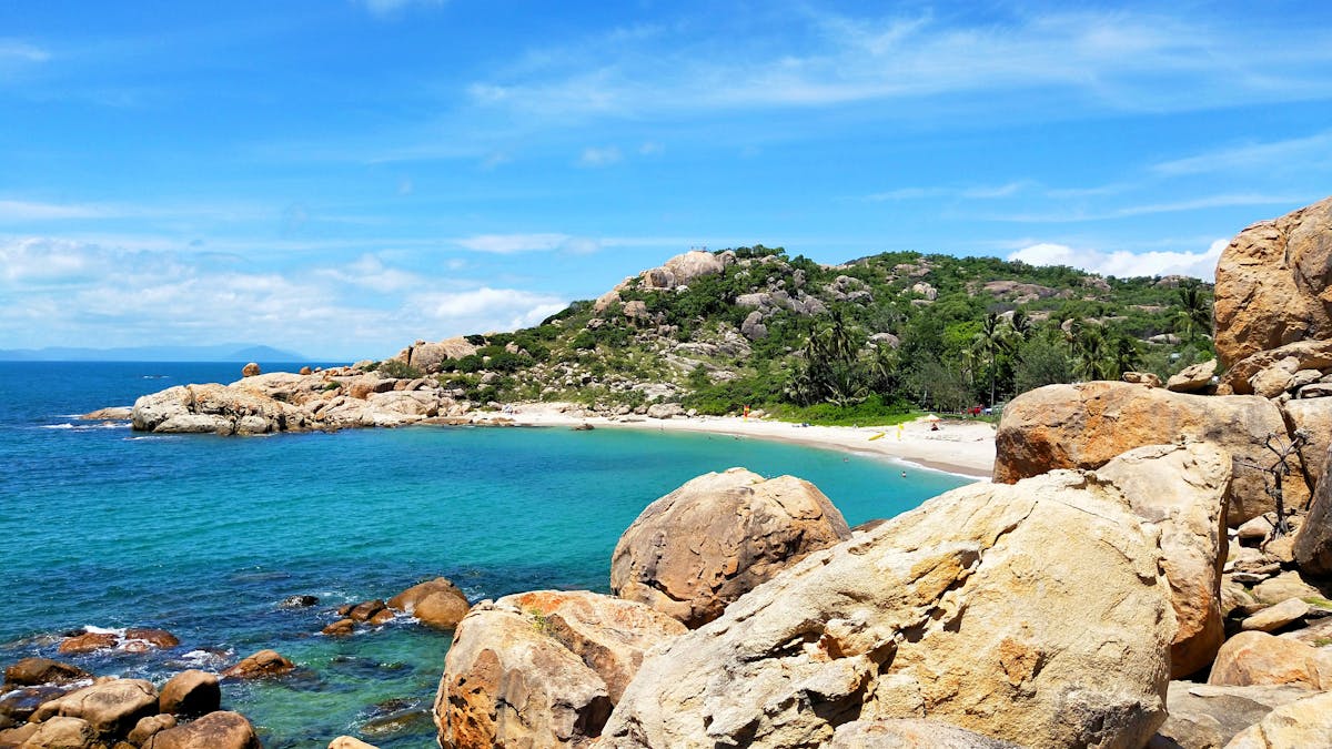 Sandy bay surrounded by granite outcrops