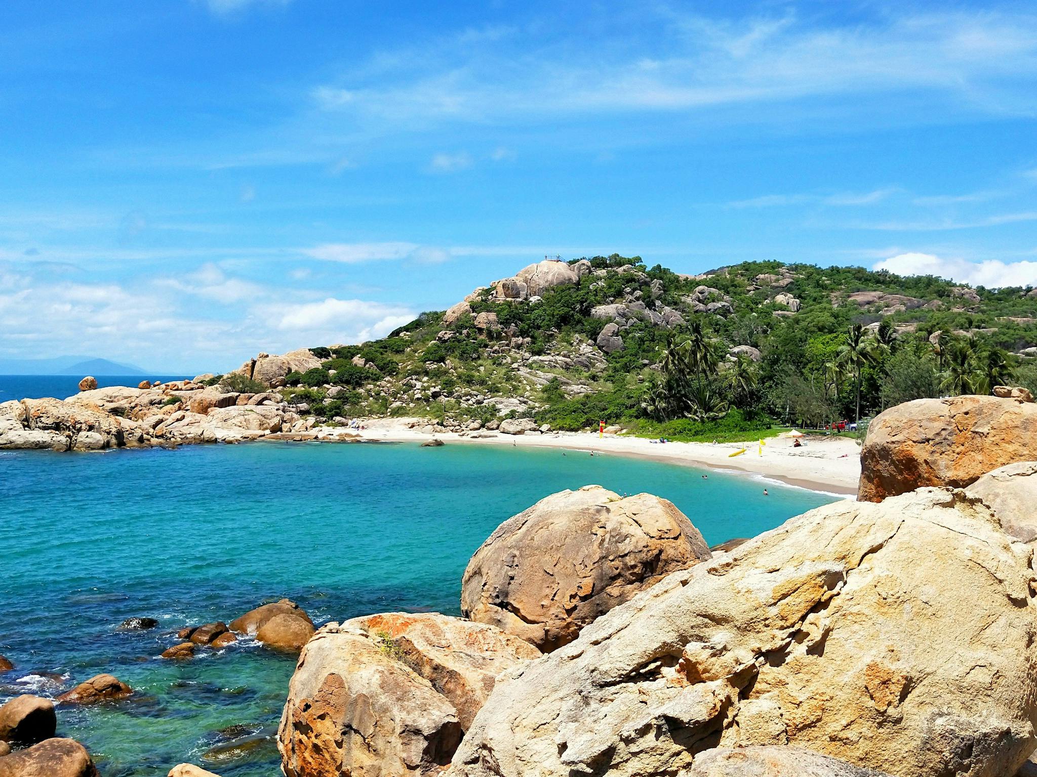 Sandy bay surrounded by granite outcrops