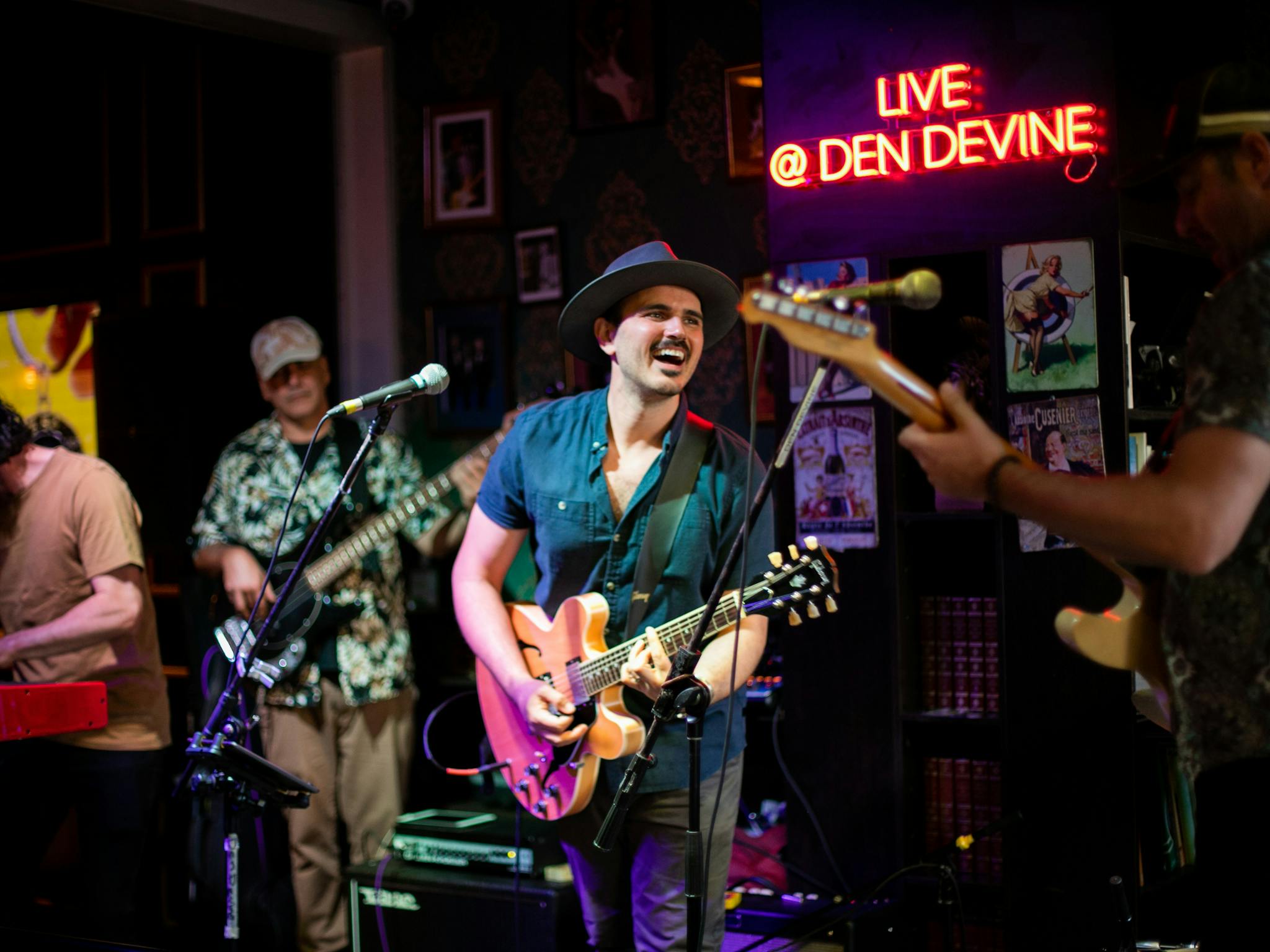 Den Devine's electrifying stage sets the scene for legendary live music, rocking 6 nights a week Den Devine's electrifying stage sets the scene for legendary live music, rocking 6 nights a week