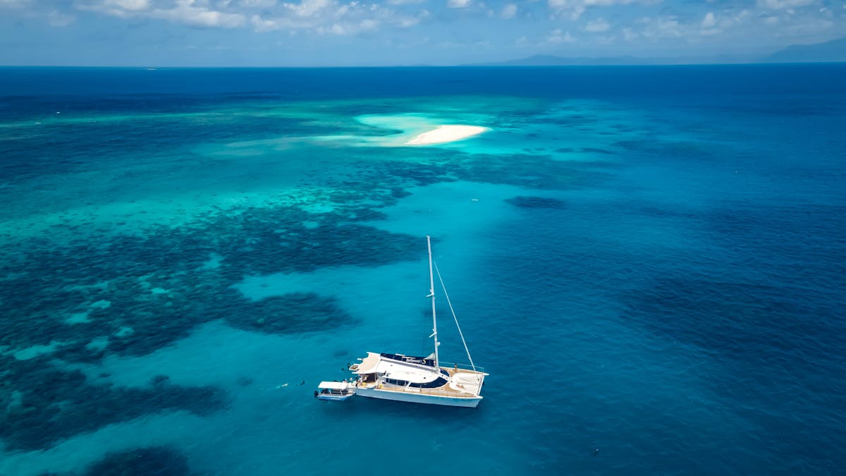 Sailaway Outer Reef bird view with Mackay Cay on the Outer Barrier Reef off Cape Tribulation