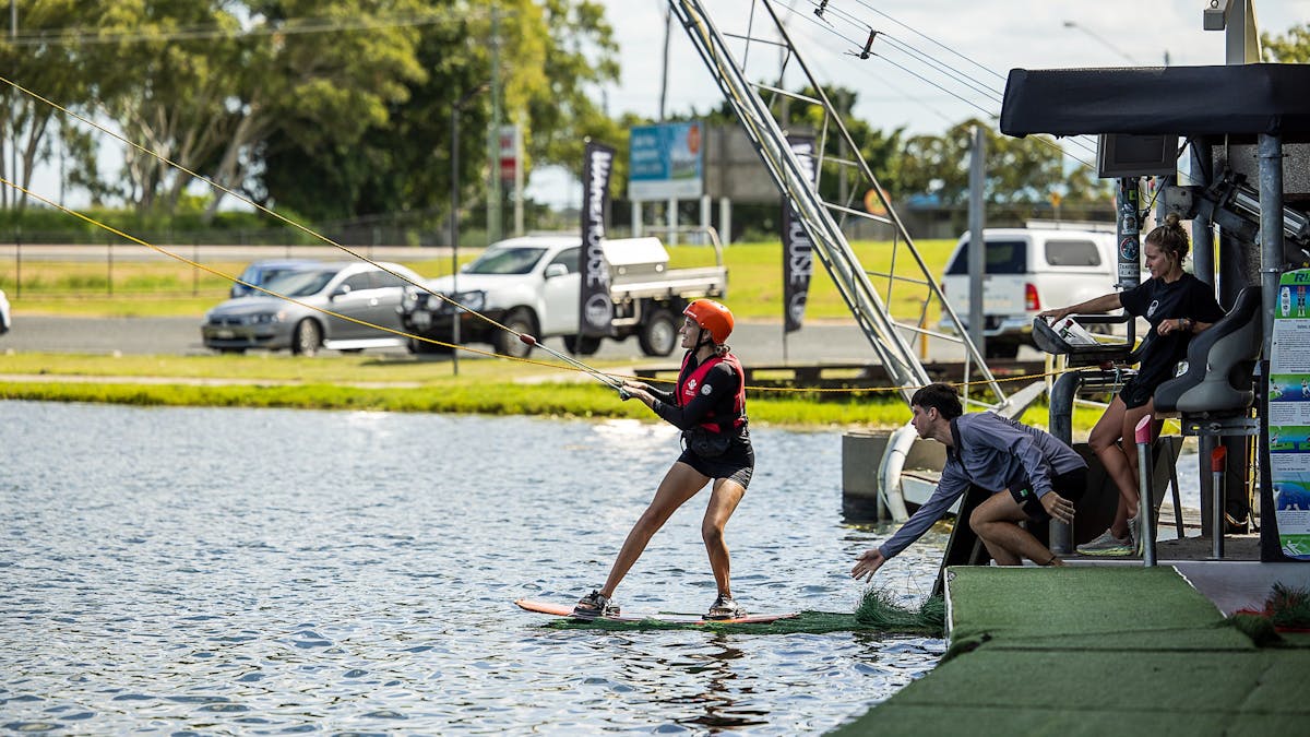 Young women learning how to wakeboard at Wake House Australia in Mackay