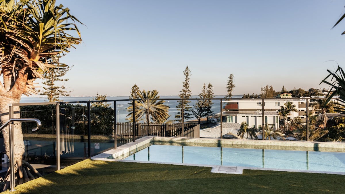 Rooftop pool with view of ocean