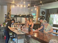 Four travellers on Taste of Tablelands tour enjoying tastings of 4 selections of liquors and spirits